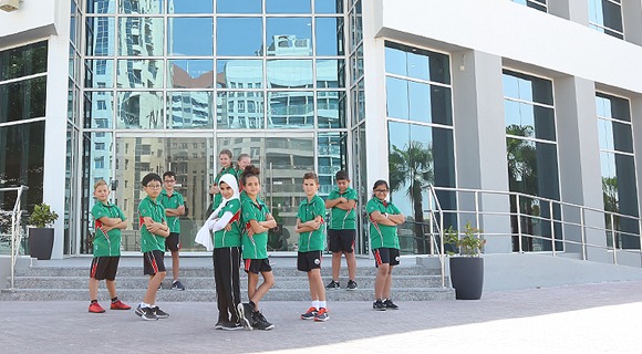 A group of students standing outside Innoventures Education building