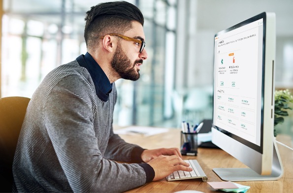 Computer user looking at Aruba Central dashboard